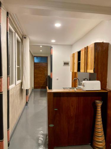 a kitchen with a sink and a counter top at Eagle View Lodge - Kigali in Kigali