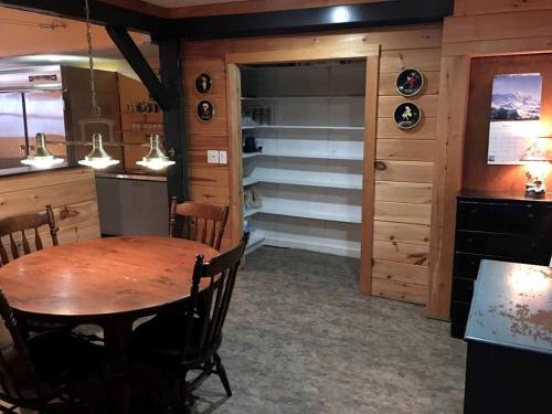 a dining room with a table and a closet at Spacious Vacation Rental for Large Groups in the White Mountains near Plymouth, New Hampshire in Plymouth