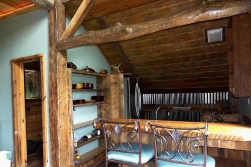 a bedroom with a bed and a wooden ceiling at Authentic Pet-Friendly Cabin Rental in Cherokee National Forest in Tennessee in Laurel Bloomery