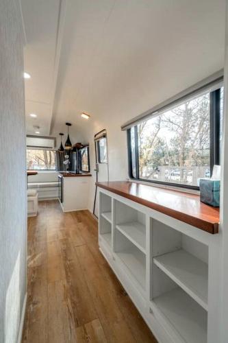a kitchen with a counter and a large window at Airstream Stay Near Whiskey Row and Granite Creek in Prescott, AZ in Prescott