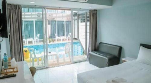Un ou plusieurs lits dans un hébergement de l'établissement Pool Villa @Donmueang