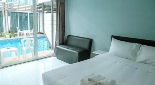 Un ou plusieurs lits dans un hébergement de l'établissement Pool Villa @Donmueang