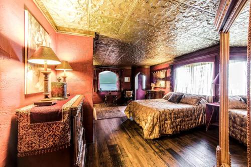 a bedroom with two beds in a room with a ceiling at Regal Suite Rental in Breathtaking Castle near Lake George, Upstate New York in Bolton Landing