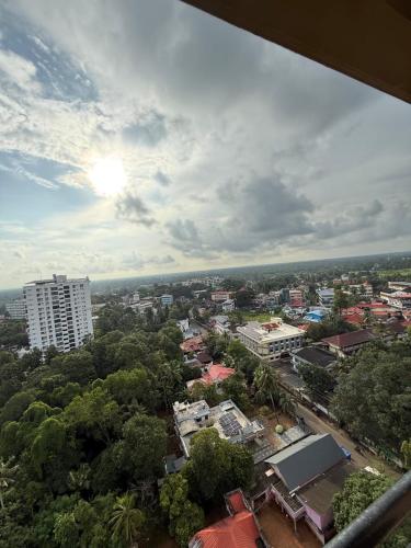an overhead view of a city with buildings and trees at Premium ,modern 2 rooms apartment in Thiruvalla