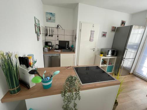 a kitchen with a sink and a counter top at Fewo Happy Heede in Heede