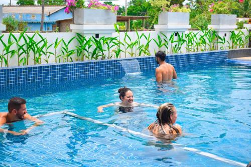 a group of people in a swimming pool at Radiance Hotel in Trincomalee