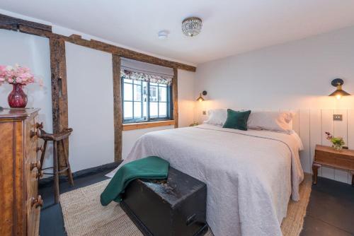 a bedroom with a large bed and a window at The Haven in Sandwich