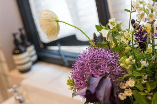 a bouquet of flowers in a vase on a table at The Haven in Sandwich