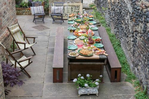 a long table with plates of food on it at The Haven in Sandwich