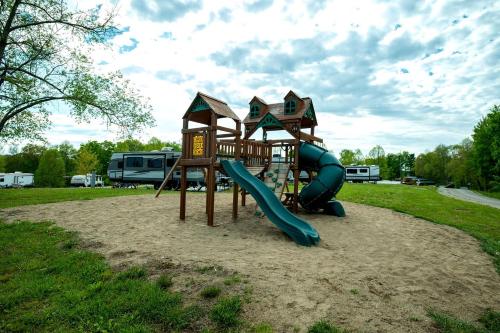 a playground with a slide in a park at Impressive Tented Cabin with Peaceful Vistas and Fire Pit in Logan, Ohio in Logan