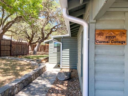 a building with a sign on the side of it at Pet-Friendly Glamping Cabin, with River Access in Ingram, Texas in Hunt