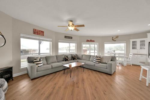 a living room with a couch and a table at Lighthouse Views & Lake Vibes – 4BR Retreat in Livingston, TX in Blanchard