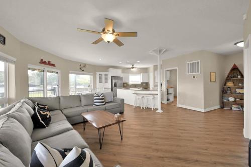 a living room with a couch and a ceiling fan at Lighthouse Views & Lake Vibes – 4BR Retreat in Livingston, TX in Blanchard