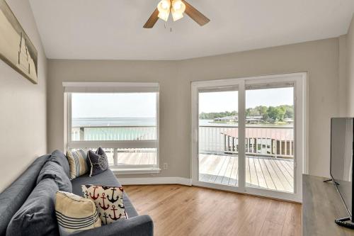 a living room with a couch and a sliding glass door at Lighthouse Views & Lake Vibes – 4BR Retreat in Livingston, TX in Blanchard