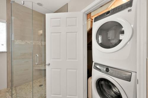 a white washer and dryer in a bathroom at Lighthouse Views & Lake Vibes – 4BR Retreat in Livingston, TX in Blanchard