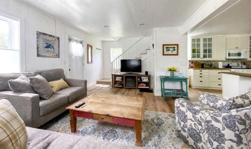 a living room with a couch and a coffee table at Beautiful Wells Rental Family Vacation in New York in Wells