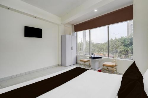 Super Hotel O Sector 51 Metro Station Formerly Shubham Residencyにあるベッド