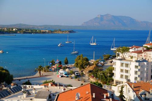 a view of a town and the ocean with boats at Beyaz Konak Evleri in Datca