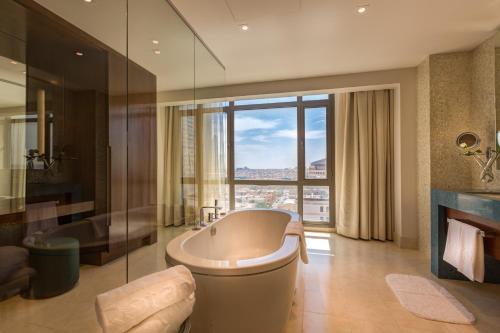 A bathroom at Rosh Rayhaan by Rotana