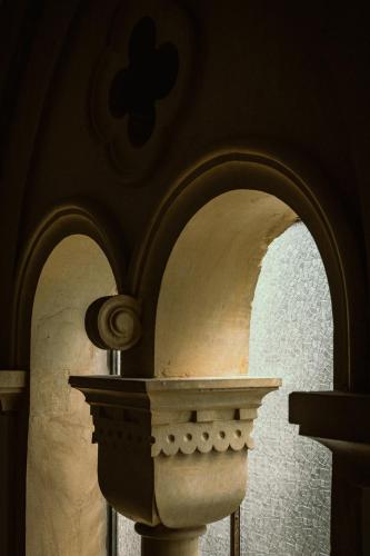 an archway in a church with a statue on it at Palazzo Piccinno in Parabita