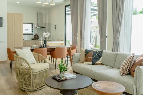 a living room with a couch and chairs and a table at New 3BR Pool Villa w Jacuzzi Ao Nang Krabi in Ban Khlong Haeng