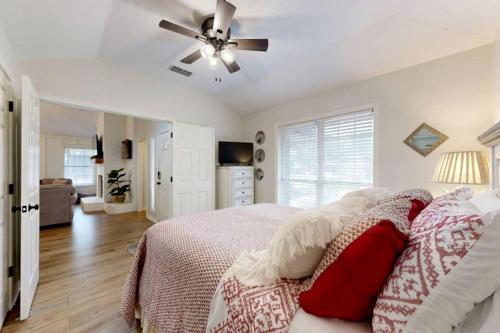 a bedroom with a bed and a ceiling fan at Charming Remodeled Home with Modern Comforts Near TAMU & Downtown in Bryan, Texas in Bryan