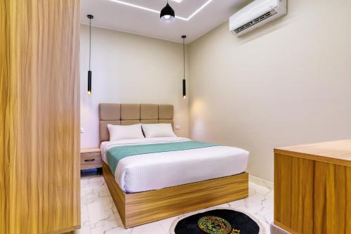 Ένα ή περισσότερα κρεβάτια σε δωμάτιο στο La Prestigia luxury Apartments by Peaks