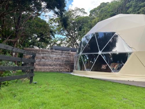 a tent in a field in a yard at GLAMFOREST Okinawa 名護 in Nago