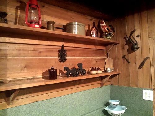 a wooden shelf with various items on it at Cozy Vacation Rental with High-Speed Wi-Fi near Seven Springs, Pennsylvania in Champion