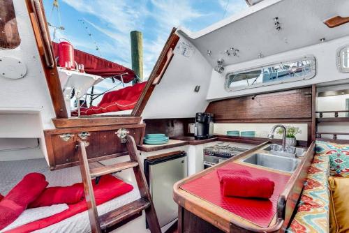 a kitchen with a sink and a table in a boat at Picturesque Equipped Boat Rental Incredible for a Relaxing Getaway in Florida in Moultrie Junction