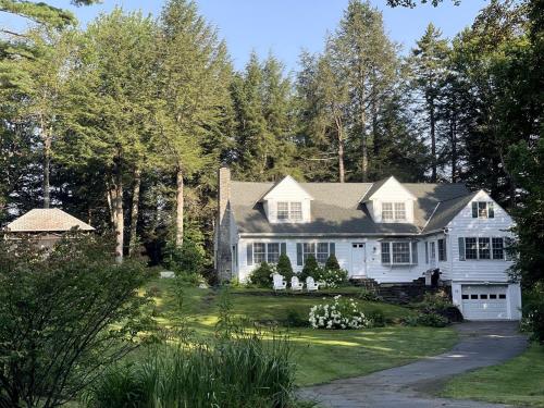 a white house with trees and a driveway at Unique Ski Rental in Berkshires Charlemont Near Hawley State Forest, Plainfield, Western Massachusetts in Plainfield