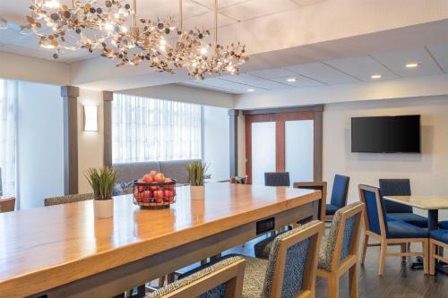 a conference room with a large wooden table and chairs at Hampton Inn Akron-South in Akron
