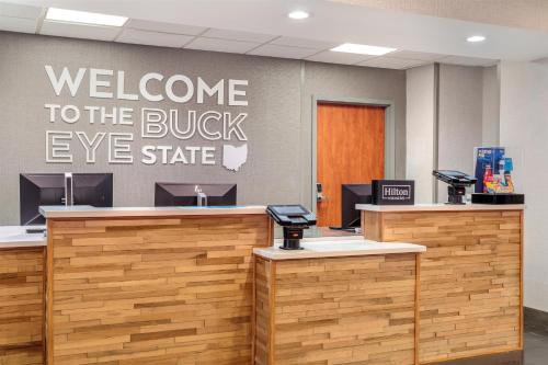 a welcome to the buckeye state sign in an office lobby at Hampton Inn Akron-South in Akron