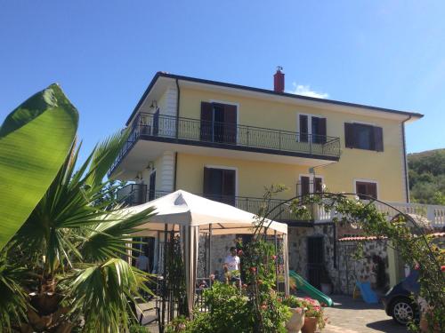 a villa with a house in the background at Villa Malandrino Guest House in Agropoli