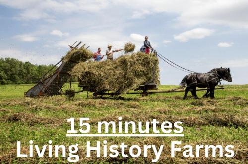 a horse pulling a cart full of hay at Stunning Tented Cabin with Fire Pit in Des Moines, Iowa in Marquisville