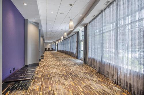 a hallway of a building with a floor of leaves at Hampton Inn & Suites Raleigh-Durham Airport-Brier Creek in Raleigh