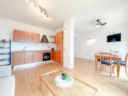 a kitchen and dining room with a table and a dining room at Vista Mare - Spiaggia a 50 mt - AC in Savona