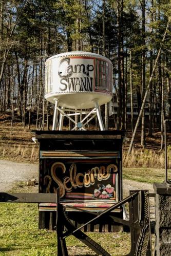 a large chair sitting on top of a piano at Experience the Magic of Our Original Family Cabin in Tracy City, TN in Tracy City