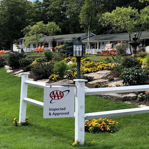 a white fence with a sign on it with aokedoked and approved sign at Cozy Bed and Breakfast with Beautiful Bay Views near Rockland, Maine in Lincolnville