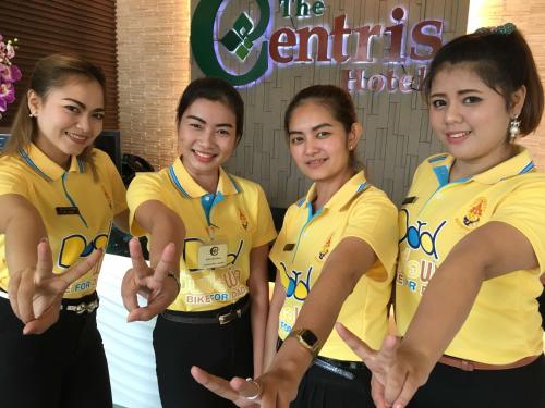 a group of girls in yellow shirts posing for a picture at The Centris Hotel Phatthalung in Phatthalung