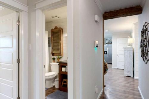 a bathroom with a toilet and a sink at Modern Farmhouse Escape with Patio & Fire Pit in Bryan, Texas in Bryan