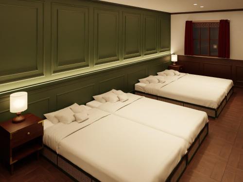 Ένα ή περισσότερα κρεβάτια σε δωμάτιο στο TRANSCENDER HOTEL Yokohama