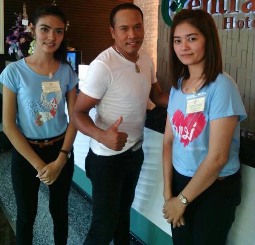 a man and two women standing next to each other at The Centris Hotel Phatthalung in Phatthalung
