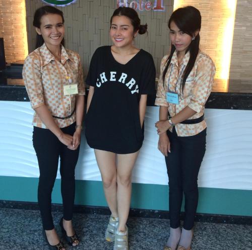 a group of three women standing next to each other at The Centris Hotel Phatthalung in Phatthalung