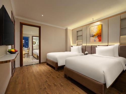 Ένα ή περισσότερα κρεβάτια σε δωμάτιο στο Hanoi Splendid Premium Hotel