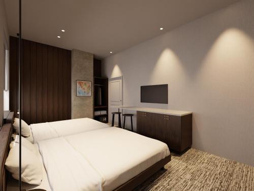 Ένα ή περισσότερα κρεβάτια σε δωμάτιο στο TRANSCENDER HOTEL Yokohama