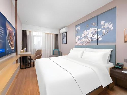 Ένα ή περισσότερα κρεβάτια σε δωμάτιο στο Magnotel Classic Shenyang General Hospital of Northern Theater Command