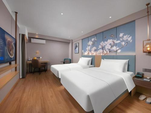 Ένα ή περισσότερα κρεβάτια σε δωμάτιο στο Magnotel Classic Shenyang General Hospital of Northern Theater Command