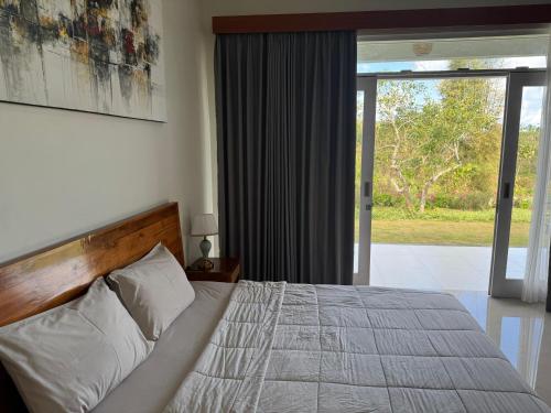 Postel nebo postele na pokoji v ubytování Octa House Pandawa Beach