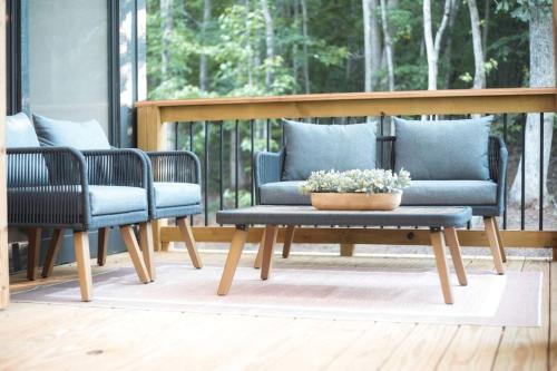two chairs and a coffee table on a porch at Luxury Mountain Retreat with Hot Tub Near Lake Hartwell & Clemson, SC in South Union